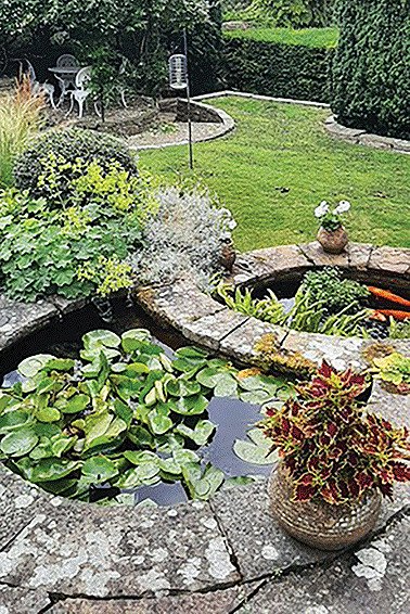 A cascade of ponds behind a flint wall